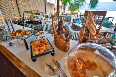 a buffet of food on a table at a restaurant at Phi Phi CoCo Beach Resort in Phi Phi Don