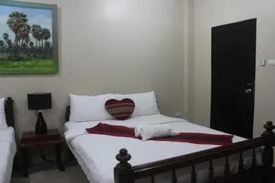 a bedroom with a bed with a pillow on it at Freedom Kata in Kata Beach