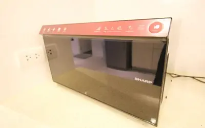 a microwave oven sitting on top of a counter at Zen Hillside Self Service Apartment in Kamala Beach