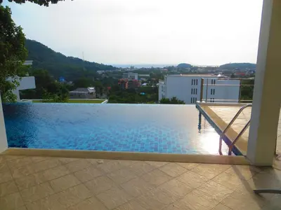 a swimming pool on the roof of a building at Villa Ginborn amazing 5-Bedroom Sea-View Pool Villa 5 Minutes to Kata Beach in Kata Beach