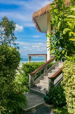 a staircase leading up to a beach house at Purana Resort Koh Yao Noi - SHA Extra plus in Ko Yao Noi
