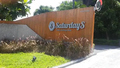 a wooden fence with a sign that says santander companies at Modern Luxury King Suite Pool View Sauna 57sqm in Rawai Beach