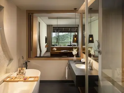 a bathroom with a sink and a mirror at Avista Hideaway Phuket Patong - MGallery in Patong Beach