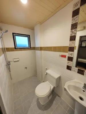 a bathroom with a toilet and a sink at Blanco Central in Phi Phi Don