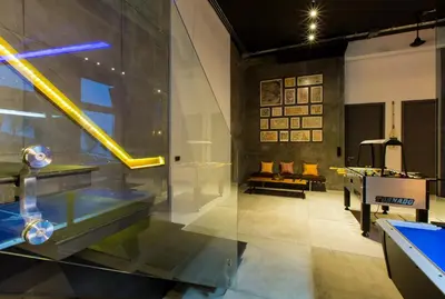 a room with a ping pong table and a glass wall at Villa Momo Private Pool near Kata Beach in Kata Beach