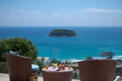 a view of an island in the ocean from a balcony at The heights Penthouse Ocean view A11 Near Kata Beach in Kata Beach