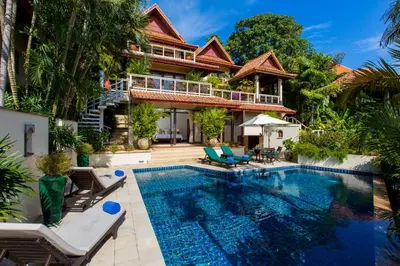 a villa with a swimming pool and a house at Katamanda Kata View villa E5 near kata Noi Beach in Kata Beach