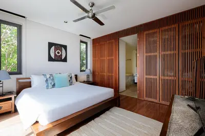 a bedroom with a bed and a ceiling fan at The heights Kata seaview C1 near Kata Beach in Kata Beach