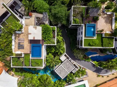 an overhead view of a house with a swimming pool at Kata Gardens Penthouse sea view 4C near Kata Noi Beach in Kata Beach