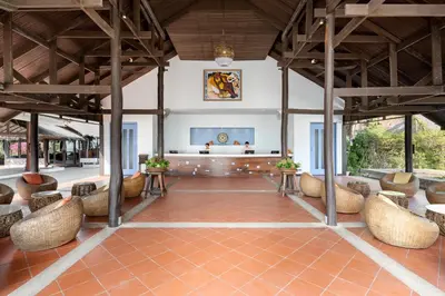 a lobby with chairs and a stage in a building at SAii Phi Phi Island Village in Phi Phi Don