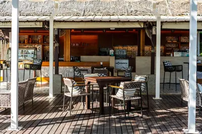 a table and chairs sitting on a patio at SAii Phi Phi Island Village in Phi Phi Don