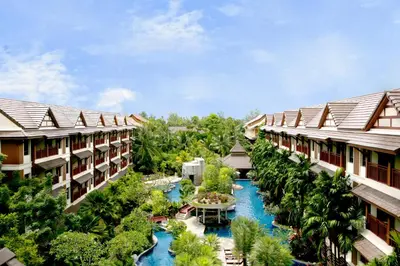 an aerial view of a resort with a river between two buildings at Kata Palm Resort - SHA Plus in Kata Beach