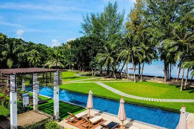 an image of a resort with a swimming pool and palm trees at The Mangrove Phuket by Blu Monkey in Panwa Beach