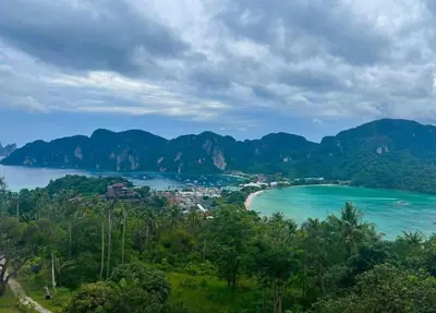 a view of a bay with mountains in the background at Blanco Beach Bar Hostel in Phi Phi Don