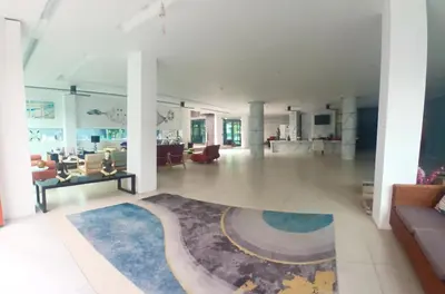 a large living room with a blue rug on the floor at Studio at Kris Condo walk to Bangtao beach 2304 in Bang Tao Beach