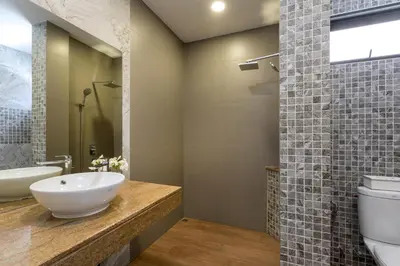 a bathroom with a sink and a toilet at Twin Villas Seaview Kata in Kata Beach