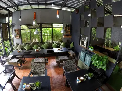 an overhead view of a living room with couches and tables at Alphabeto Resort in Nai Harn Beach