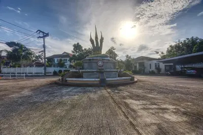 a statue in the middle of a dirt road at Sea eagle pool villa in Ao Nang Beach