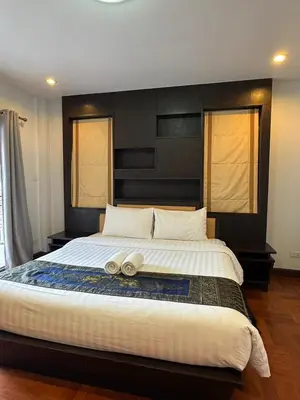 a large bed with two pillows on top of it at Poonsiri Private Pool Villa Aonang in Ao Nang Beach