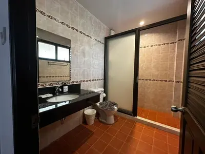 a bathroom with a sink and a shower with a mirror at Poonsiri Private Pool Villa Aonang in Ao Nang Beach