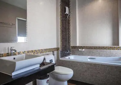a bathroom with a sink and a toilet and a tub at Poonsiri Private Pool Villa Aonang in Ao Nang Beach