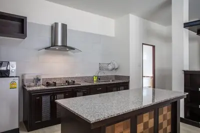 a kitchen with a sink and a counter top at Poonsiri Private Pool Villa Aonang in Ao Nang Beach