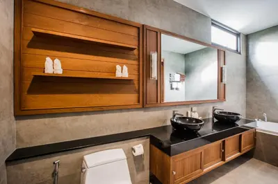 a bathroom with two sinks and a mirror at Villa Palavee (B2) in Ao Nang Beach