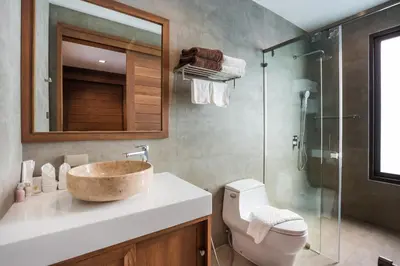 a bathroom with a sink and a glass shower at Villa Palavee (B2) in Ao Nang Beach
