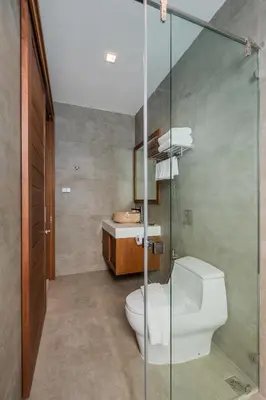 a bathroom with a toilet and a sink at Villa Palavee (B2) in Ao Nang Beach