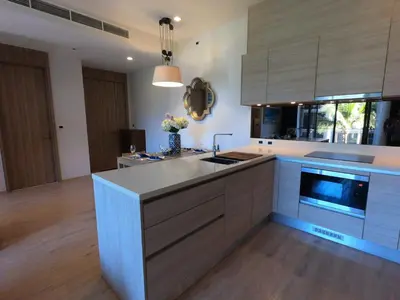 a kitchen with a sink and a counter top at Baan Mai Khao condo in Mai Khao Beach