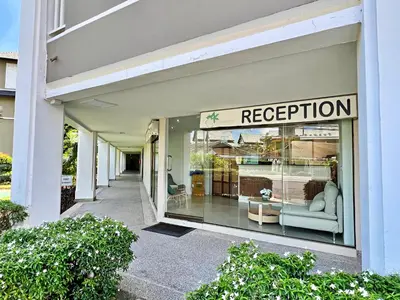 a store window with a sign that reads reception at Allamanda Laguna Phuket by RESAVA in Bang Tao Beach