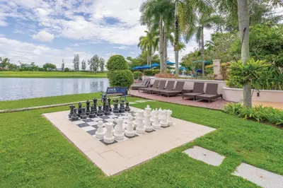 a chess board in the middle of a lawn at Homm Suites Laguna, part of Banyan Group in Bang Tao Beach