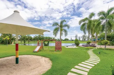 a park with a playground and a swing at Homm Suites Laguna, part of Banyan Group in Bang Tao Beach