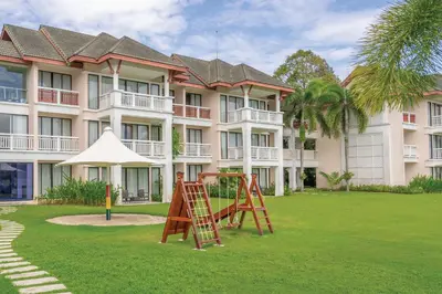 a playground in front of a large building at Homm Suites Laguna, part of Banyan Group in Bang Tao Beach