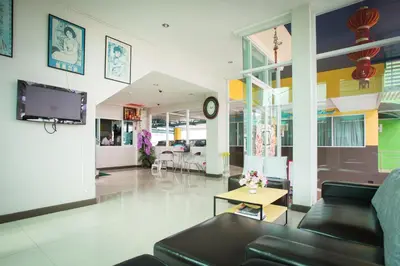a living room with a couch and a table at Central Residences in Phuket Town