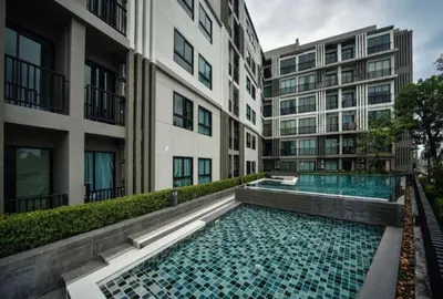 a swimming pool in the middle of a building at Zcape at Bangtao in Bang Tao Beach