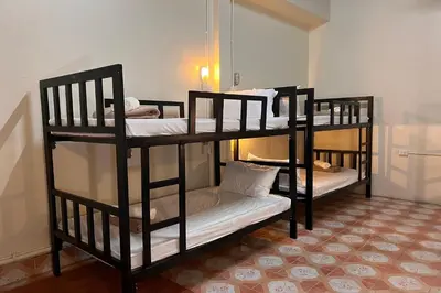 two sets of bunk beds in a room at Phuket Old Town Hostel in Phuket Town