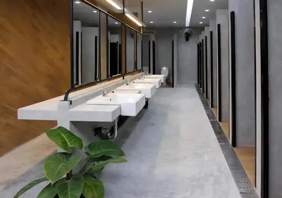 a row of sinks in a bathroom with mirrors at TAN Hostel x Cafe , Aonang Beach in Ao Nang Beach