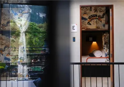 a room with a bed and a window at TAN Hostel x Cafe , Aonang Beach in Ao Nang Beach