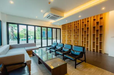 a living room with a couch and chairs and a table at The Aristo by Holy Cow, 2-BR, 60 m2, pool view in Surin Beach
