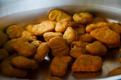 a bowl of fried food sitting on a table at Baan Tubkaek Hotel in Tab Kaek Beach