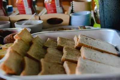a plate of sandwiches sitting on a table at Baan Tubkaek Hotel in Tab Kaek Beach