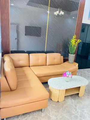 a living room with a couch and a table at Siray Green Resort in Phuket Town