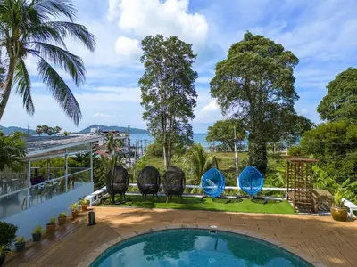 a view from the balcony of a house with a swimming pool at Daydream villa resort in Patong Beach