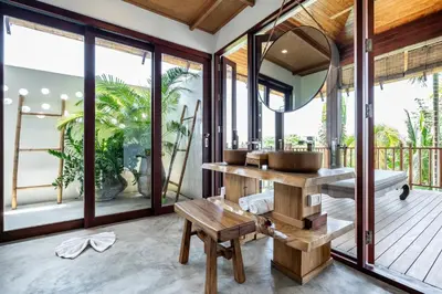 a bathroom with a sink and a mirror at Cho Fah Residence in Ko Yao Noi