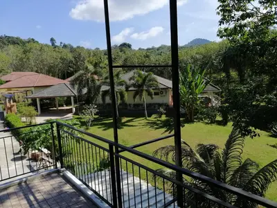 a view from the balcony of a house at Twin Villa in Ban Muang Mai