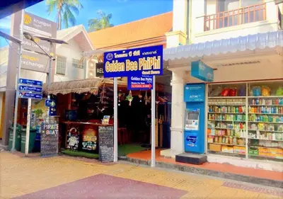 a group of shops on the side of a street at Golden Bee PhiPhi in Phi Phi Don