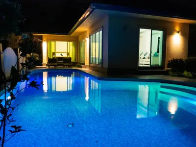 a swimming pool at night with a house at Villa Tanya, 3 Bed with Private Pool and Jacuzzi in Rawai Beach