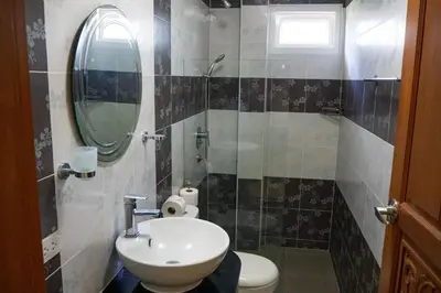 a bathroom with a sink and a mirror and a toilet at Villa Tanya, 3 Bed with Private Pool and Jacuzzi in Rawai Beach