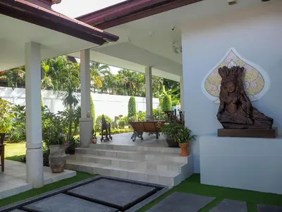 a statue on the front porch of a house at Spacious 4 Bedrooms Private Pool Villa in Phuket in Rawai Beach